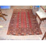 An antique Middle Eastern rug with geometric borde