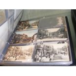 An album containing various collectable postcards