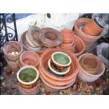 A quantity of terracotta planters and pots