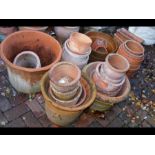 A quantity of terracotta planters and pots