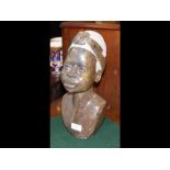 A carved hard stone figure of a African lady with