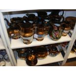 A quantity of bronzed lustre ware - on two shelves