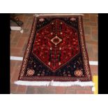 A Persian rug with diamond design - 120cm x 78cm