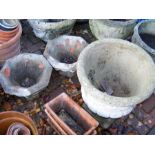 Two stone octagonal planters and a concrete urn