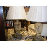 A pair of glass based table lamps