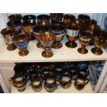 A quantity of bronzed lustre ware - on two shelves