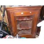 An oak corner cabinet (missing glazed panel)