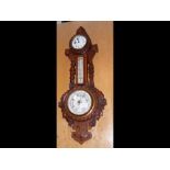 An antique oak cased barometer, clock, thermometer