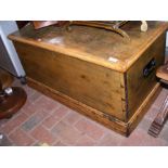 An antique pine blanket chest with handles to the