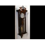 A walnut cased Vienna regulator style wall clock w
