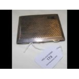 An engine turned silver cigarette case