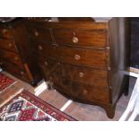 A Georgian mahogany bow fronted chest of two short