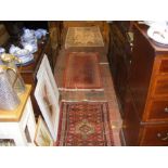 Three rugs of varying shape and size