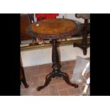 A Victorian circular walnut tripod table with spir