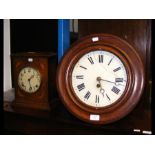 A late Victorian oak circular wall clock with sing