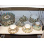 A quantity of turquoise and gilt patterned china