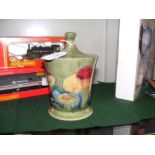 A William Moorcroft tobacco jar and cover - 16cms