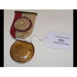 A gold plated Masonic Testimonial Medal in 9ct gol