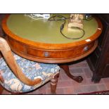 A reproduction 'drum' table with inset green leath