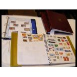 Four stamp albums containing worldwide stamps