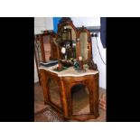 A Victorian figured walnut chiffonier with triple