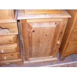 A low lying pine cupboard - width 53cms