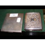 A silver engine turned cigarette case, together wi