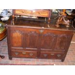 An 18th century oak mule chest with four fielded p