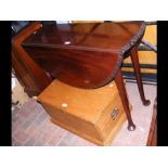 An antique mahogany pad foot drop leaf table with