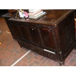 An 18th century carved oak mule chest with four fi