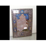 An Indo-Persian mirror with all over silver and blue enamel gilt decoration - 22cm x 16cm