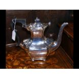 A silver teapot with Birmingham hallmark
