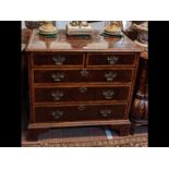 An 18th century oyster veneer walnut chest of two