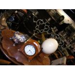 A Mappin & Webb satinwood clock, a pair of three branch brass table candelabras, an Ostrich egg and
