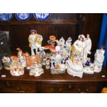 An assortment of Staffordshire figures including '