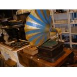 A vintage style gramophone with blue painted horn (with records)