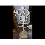 A white painted wrought iron umbrella/stick stand