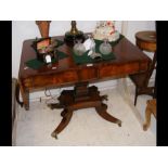 A Regency sofa table on shaped support with two dr