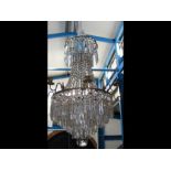 A decorative antique chandelier - 78cms in length