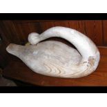A carved wooden swan