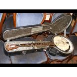 A heartwood banjo in fitted carrying case