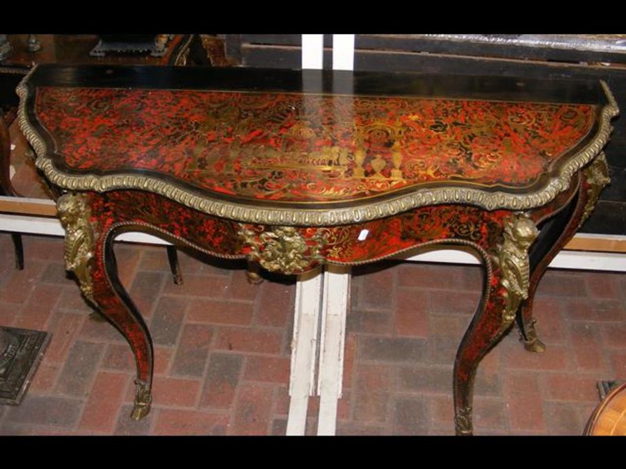 A 19th century red Boulle and ebonized side table