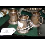 Three miniature silver tankards - each 4.5cm high