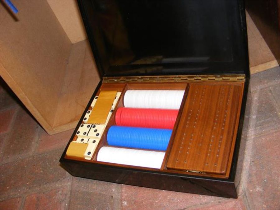 A games compendium in case inlaid with a pair of d