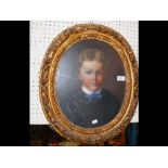 An antique oval oil portrait of young boy - 38cm