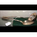 A silver ladle, basting spoon