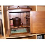 An oak smokers cabinet with Bakelite tobacco jar