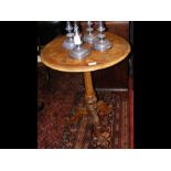 A 19th century circular wine table with inlaid vin