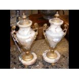 A pair of 27cm high marble and ormolu two handled