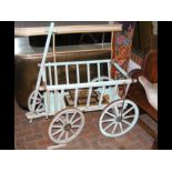 A blue painted wooden cart